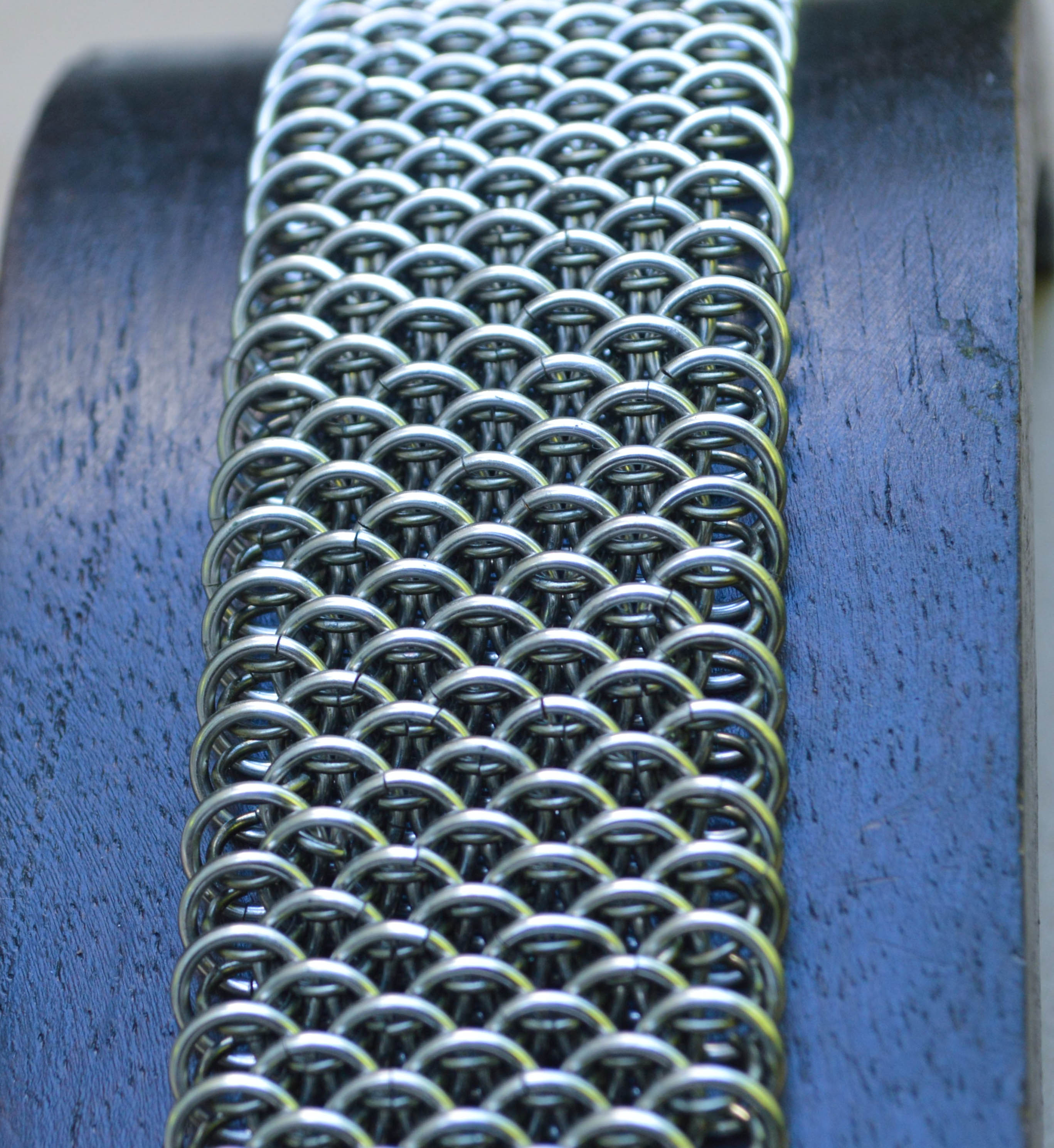 Dragoncale chainmaille weave with titanium enameled copper. 