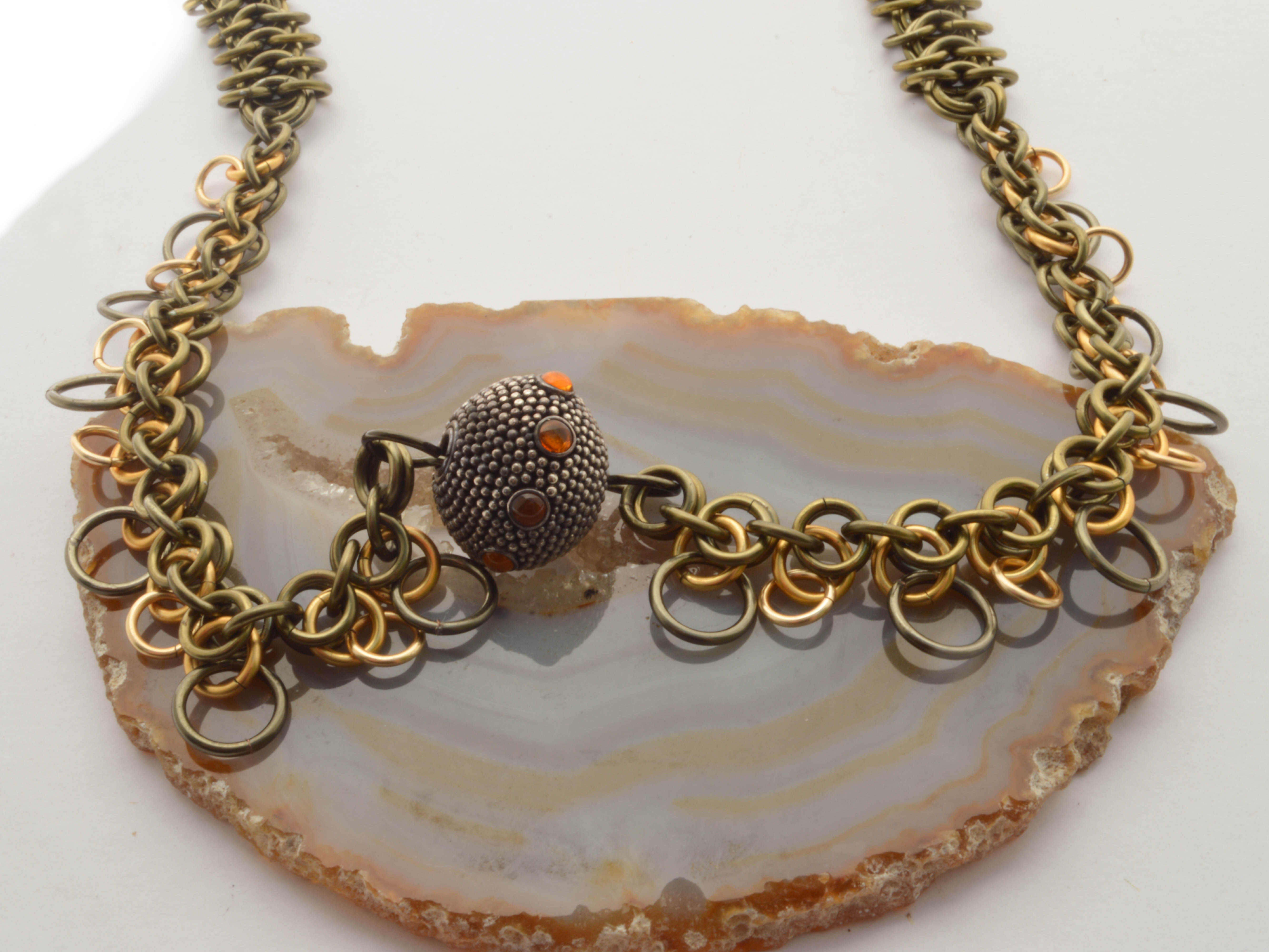 Bronze and Nugold orchid weave necklace with silver textured bead