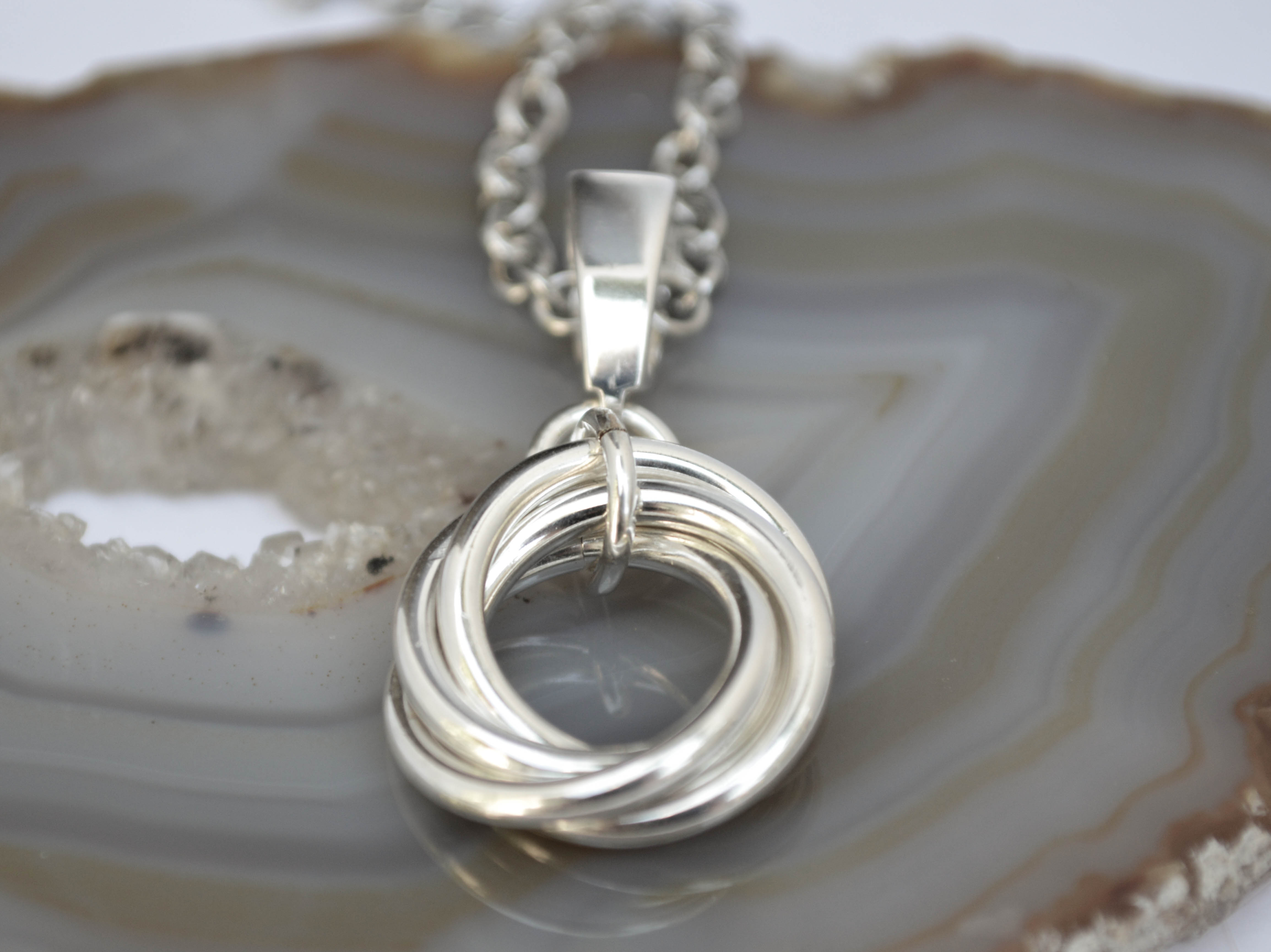 Sterling silver mobius pendant necklace. 